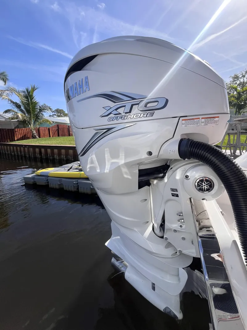 Slide: The Image of 2021 Sea Fox 368 Commander with Yamaha XTO outboard motor, docked by a canal. - 12