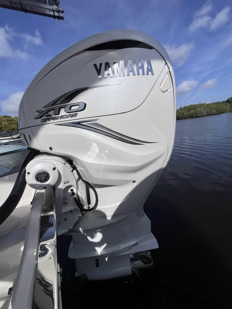Slide: The Image of Yamaha XTO outboard motor on 2021 Sea Fox 368 Commander boat, docked on a sunny day. - 13