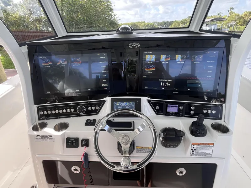 Slide: The Image of Helm of 2021 Sea Fox 368 Commander with dual displays and modern controls. - 16