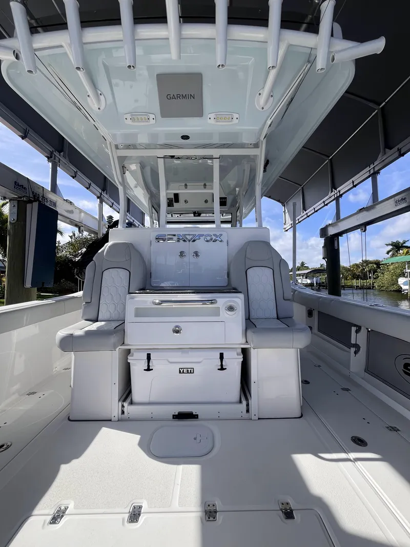 Slide: The Image of 2021 Sea Fox 368 Commander boat interior with seating and storage, featuring modern design elements. - 18