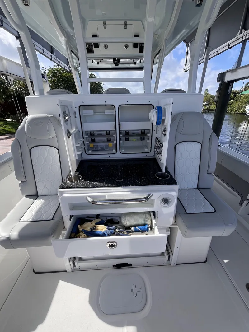 Slide: The Image of 2021 Sea Fox 368 Commander boat interior with seating and storage compartments. - 19
