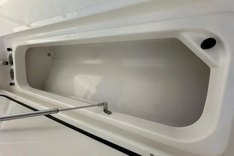 Slide: The Image of 2024 Pursuit S 358 Sport boat storage compartment, open and empty. - 15