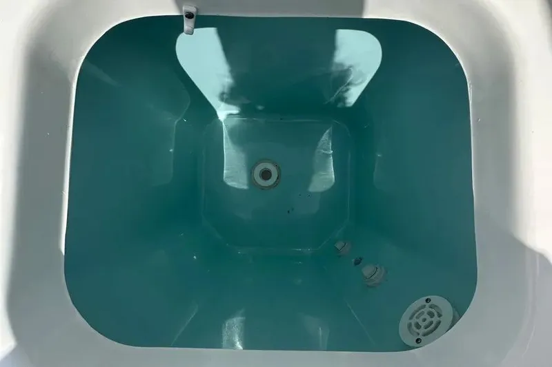 Slide: The Image of Livewell compartment of 2024 Pursuit S 358 Sport boat, empty and clean. - 6