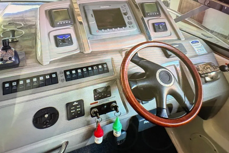 Slide: The Image of 2009 Chaparral Signature 350 dashboard with steering wheel and control panel. - 11
