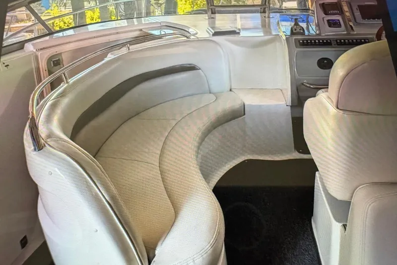 Slide: The Image of 2009 Chaparral Signature 350 boat interior with curved seating and modern dashboard. - 14