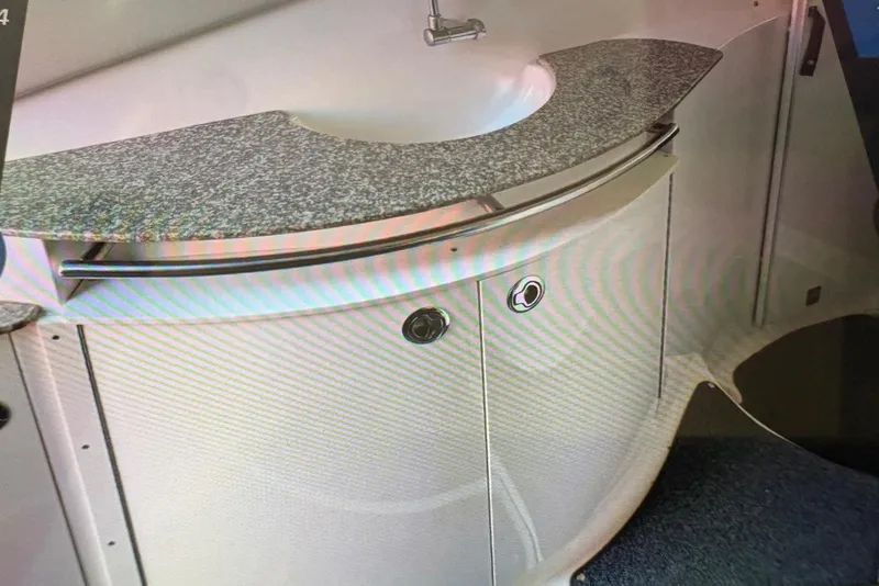 Slide: The Image of 2009 Chaparral Signature 350 bathroom with granite countertop and modern sink design. - 15