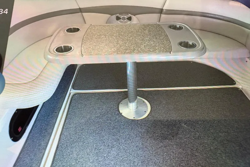 Slide: The Image of Interior of 2009 Chaparral Signature 350 with table and cup holders. - 16