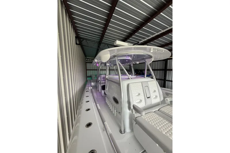 The Image of 2025 Contender 44 ST boat in storage, featuring sleek design and modern amenities. - 0