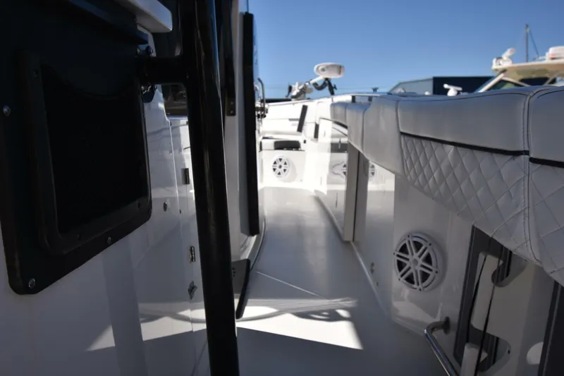 Slide: The Image of 2021 Blackfin 332 CC boat interior with white seating and sleek design. - 13