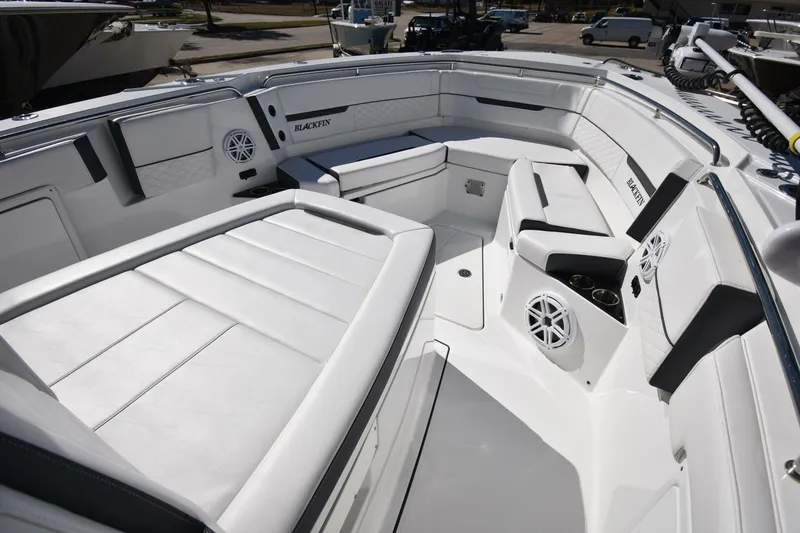 Slide: The Image of 2021 Blackfin 332 CC boat interior with spacious seating and modern design. - 17