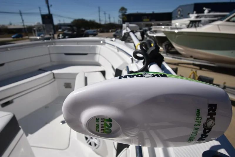 Slide: The Image of 2021 Blackfin 332 CC boat with Rhodan GPS anchor system, docked in a marina. - 22