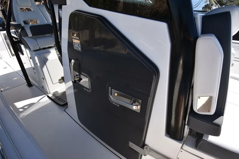 Slide: The Image of 2021 Blackfin 332 CC boat interior with sleek seating and modern design. - 24