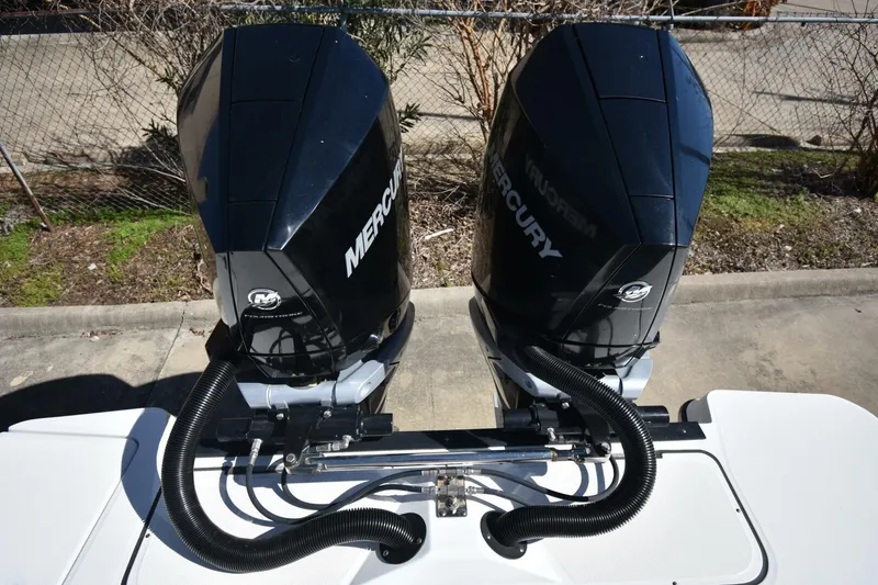Slide: The Image of Twin Mercury outboard engines on a 2021 Blackfin 332 CC boat. - 9