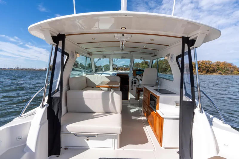 Slide: The Image of Aft facing bench seat lifts and folds to face the dinette when needed. - 3