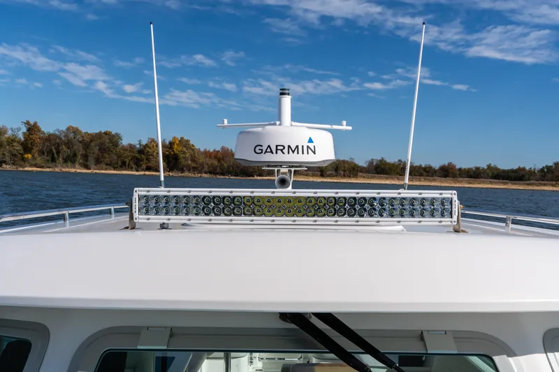 Slide: The Image of Garmin radar and LED lights on the hardtop. - 74