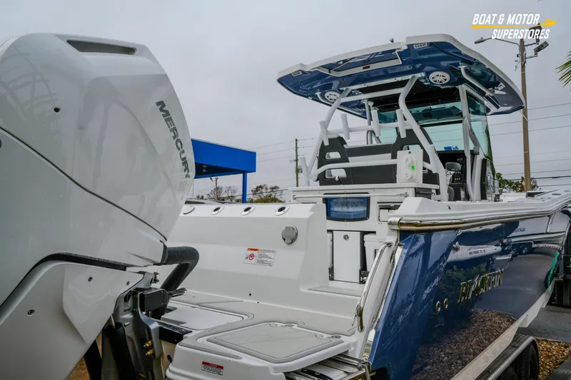 Slide: The Image of 2026 Blackfin 332 CC boat with Mercury engine at dealership. - 13