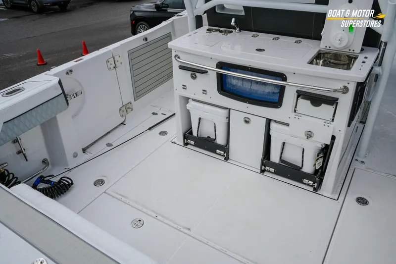 Slide: The Image of 2026 Blackfin 332 CC boat deck with storage and utility features. - 14
