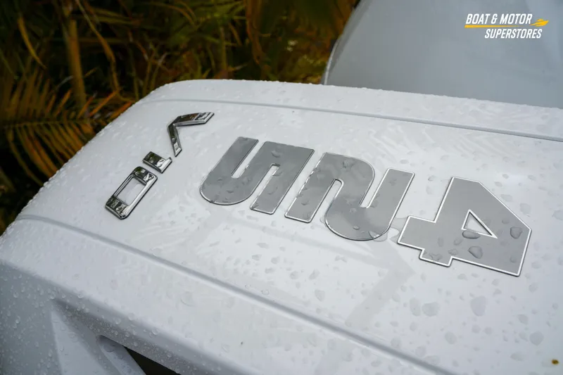 Slide: The Image of 2026 Blackfin 332 CC boat with wet surface and logo detail. - 18