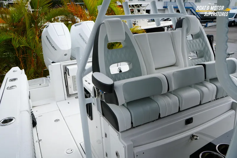 Slide: The Image of 2026 Blackfin 332 CC boat interior with luxurious seating and Mercury engines. - 27