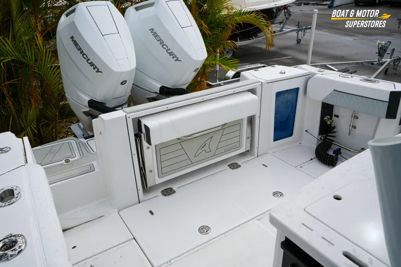 Slide: The Image of 2026 Blackfin 332 CC boat with dual Mercury engines, featuring a spacious deck layout. - 28