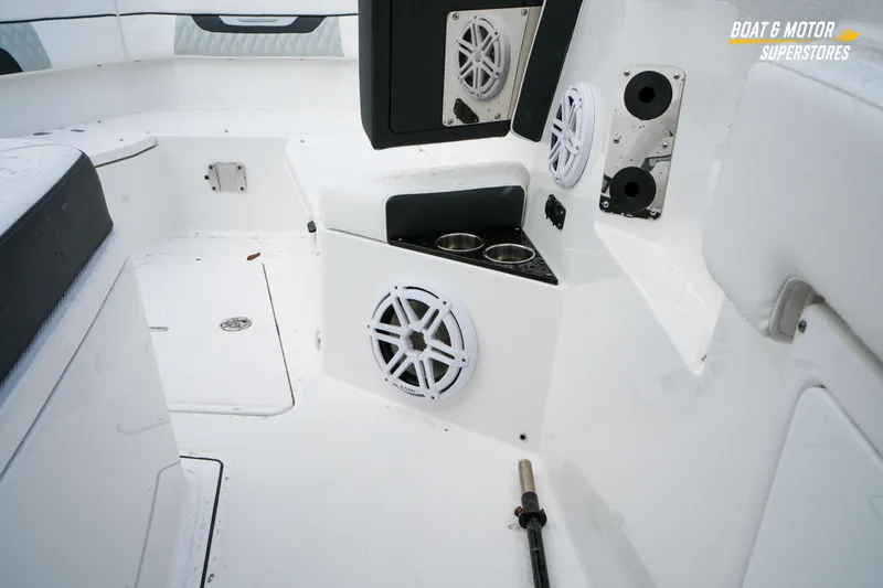 Slide: The Image of 2026 Blackfin 332 CC boat interior with speakers and cup holders. - 29