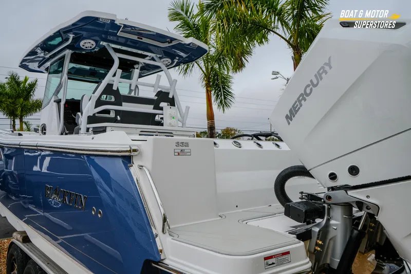 Slide: The Image of 2026 Blackfin 332 CC boat with Mercury engine, showcased at Boat & Motor Superstores. - 8