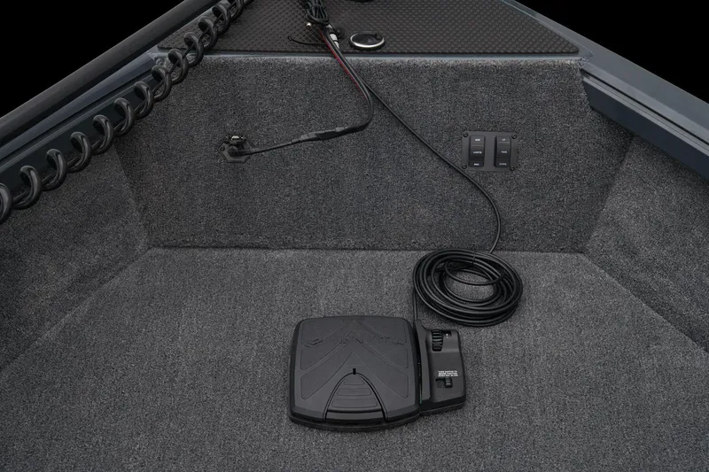 Slide: The Image of 2026 Ranger VS1665SC boat dashboard with steering wheel and controls, featuring a sleek design. - 11