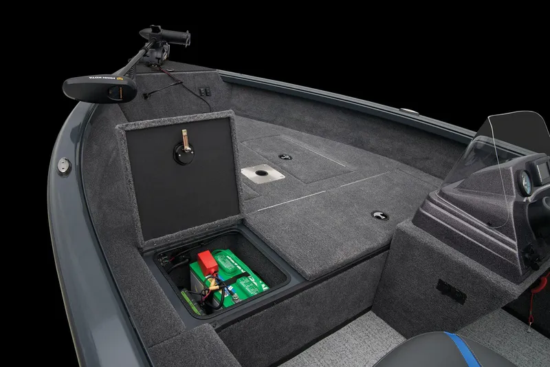 Slide: The Image of 2026 Ranger VS1665SC boat with powerful outboard motor, parked on a concrete path. - 14