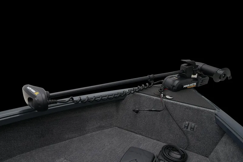 Slide: The Image of 2026 Ranger VS1665SC boat with red and gray seating, steering console, and motor. - 9