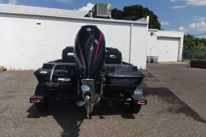 Slide: The Image of 2026 Nitro Z19 XL Pro boat with powerful outboard motor, parked outdoors. - 8