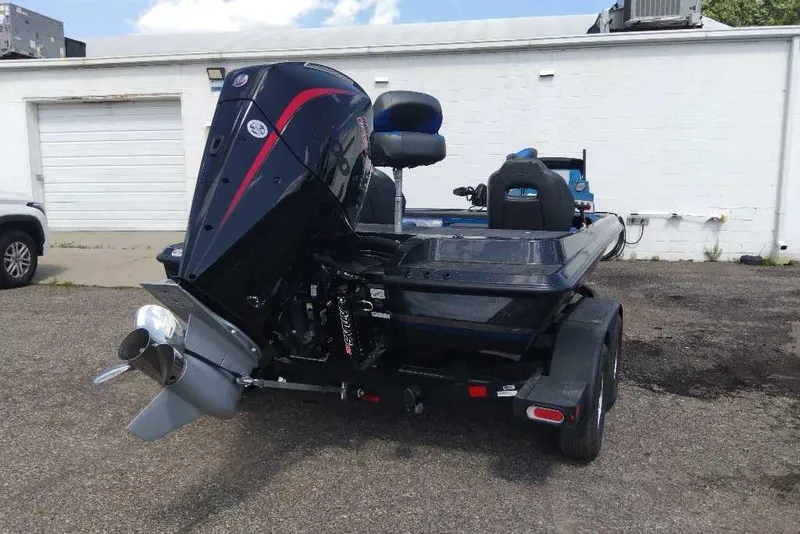 Slide: The Image of 2026 Nitro Z19 XL Pro boat with powerful outboard motor in parking lot. - 9