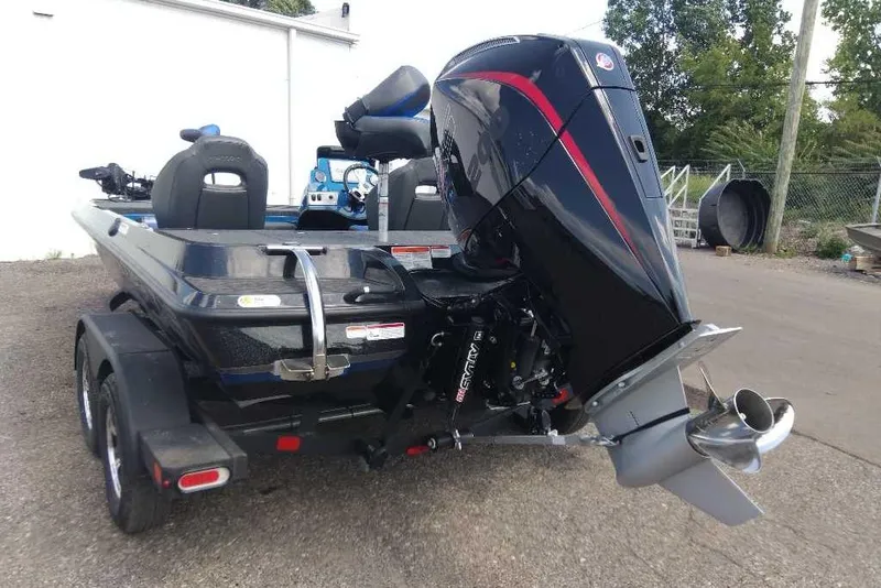 Slide: The Image of 2026 Nitro Z19 XL Pro boat with powerful outboard motor, parked on a trailer. - 6