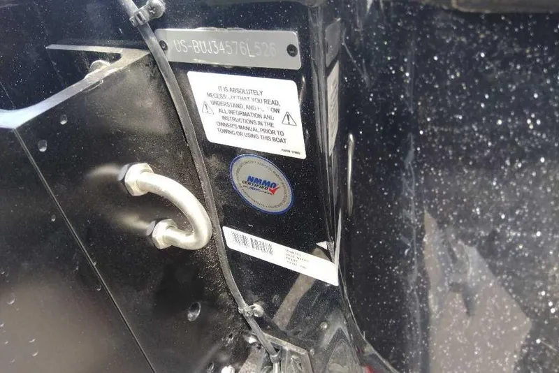Slide: The Image of Close-up of a 2026 Nitro Z19 XL Pro boat identification plate and safety labels. - 10