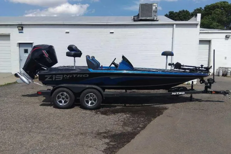 Slide: The Image of 2026 Nitro Z19 XL Pro boat on trailer, parked outside a building. - 5