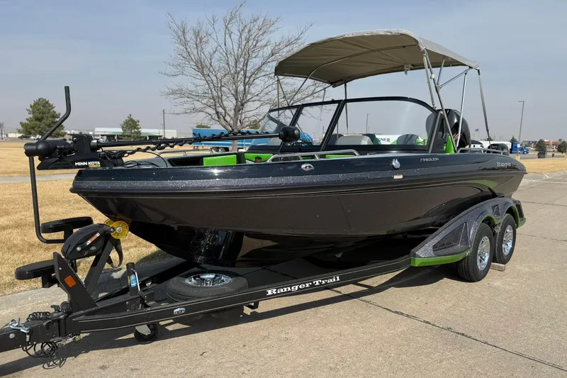 The Image of 2026 Ranger 1880MS boat on trailer, featuring sleek design and canopy. - 0