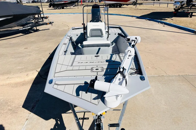 Slide: The Image of 2026 Tracker Bass Tracker Classic CC boat on display in a sunny outdoor setting. - 2