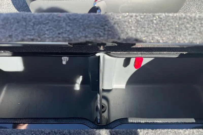 Slide: The Image of Open storage compartment of 2026 Ranger RT178 boat, showing interior details. - 11