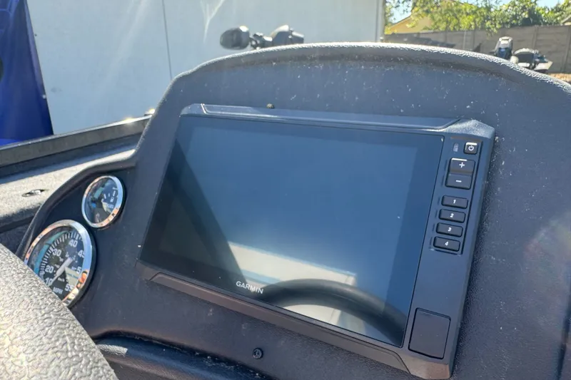Slide: The Image of Dashboard of 2026 Ranger RT178 boat featuring Garmin display and gauges. - 14