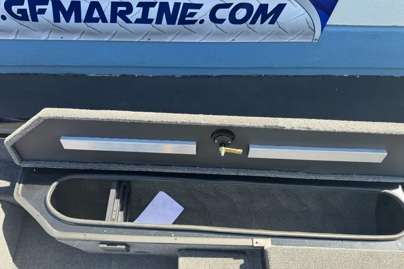 Slide: The Image of Open storage compartment of 2026 Ranger RT178 boat with visible interior details. - 17
