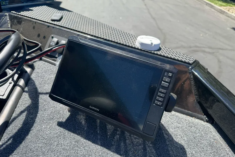 Slide: The Image of Garmin device on 2026 Ranger RT178 boat dashboard in sunlight. - 22