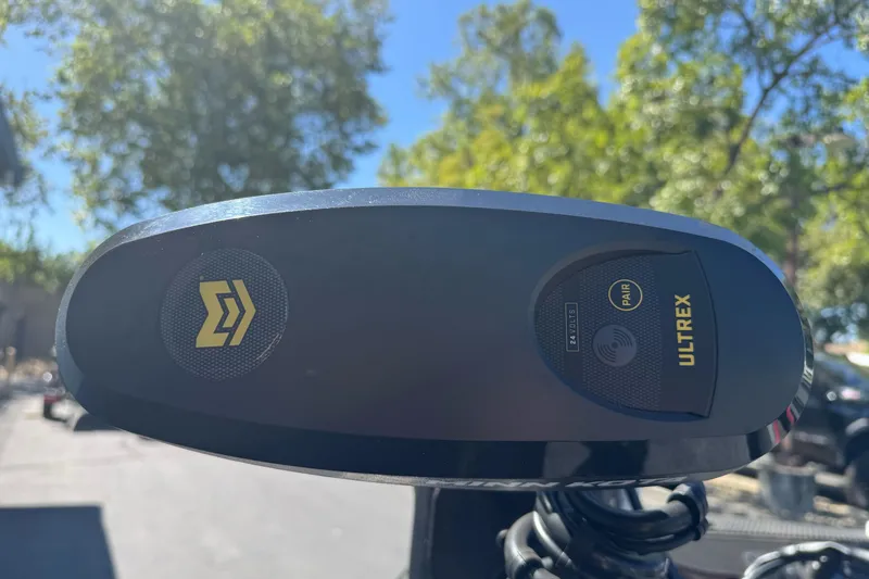 Slide: The Image of Close-up of Ultrex motor on 2026 Ranger RT178 boat, with trees in the background. - 7