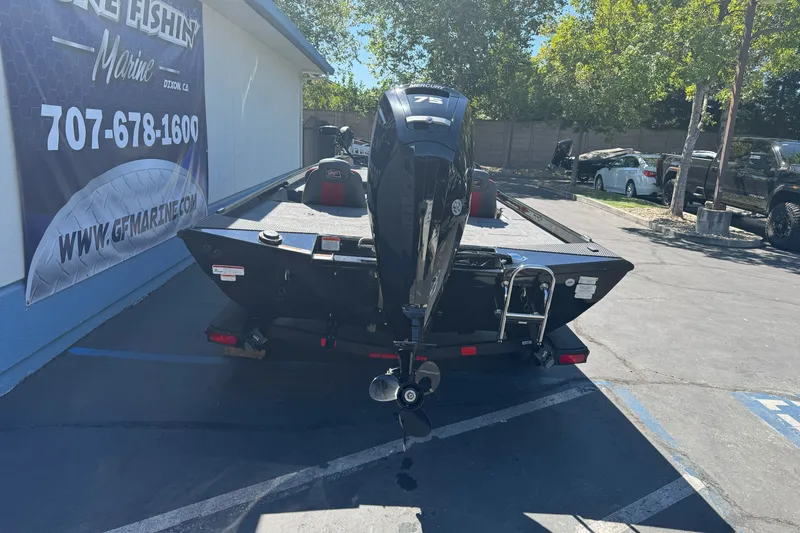 Slide: The Image of 2026 Ranger RT178 boat with outboard motor parked at dealership. - 4