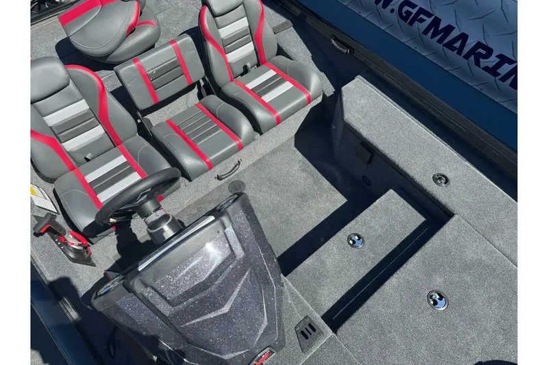 Slide: The Image of 2026 Ranger RT178 boat interior with gray and red seating, steering wheel, and storage compartments. - 20