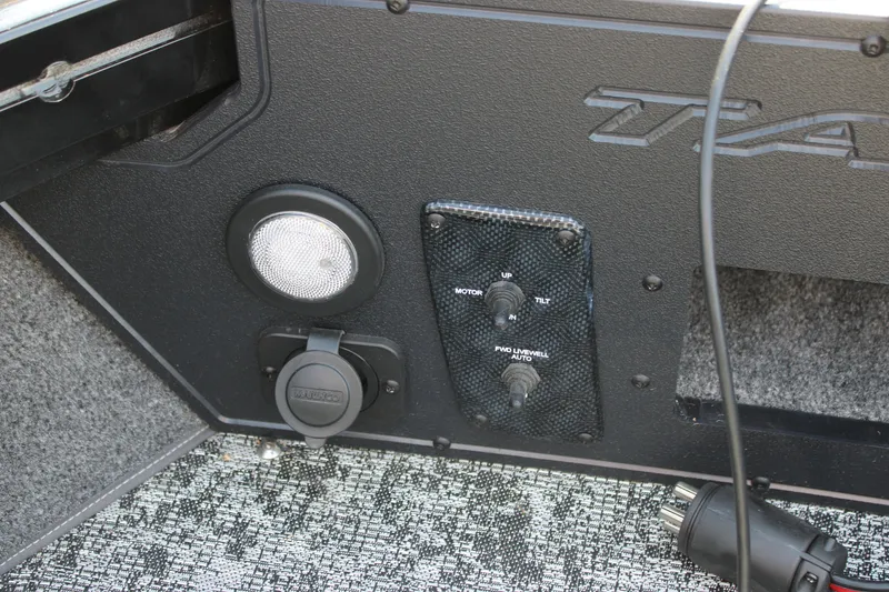 Slide: The Image of Control panel of 2026 Tracker Targa V-18 Combo boat with switches and outlets. - 15
