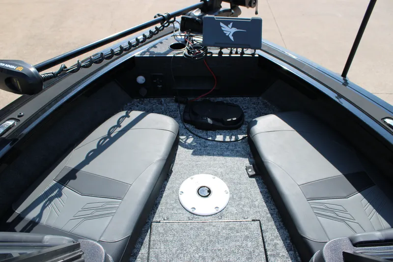 Slide: The Image of 2026 Tracker Targa V-18 Combo boat interior with seating and fishing equipment. - 14
