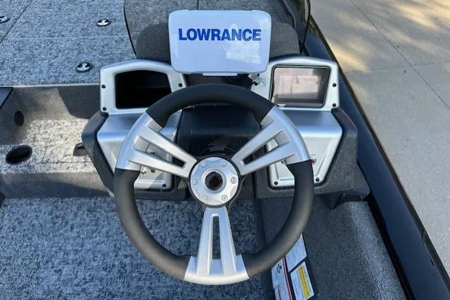 Slide: The Image of Steering wheel of 2026 Tracker Pro Team 195 boat with Lowrance display. - 5