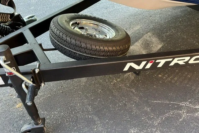 Slide: The Image of Trailer with spare tire on Nitro Z17, 2026 model, parked on asphalt. - 12