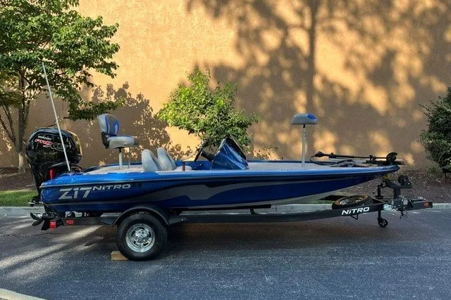 The Image of 2026 Nitro Z17 boat in blue, parked on a trailer, side view. - 0