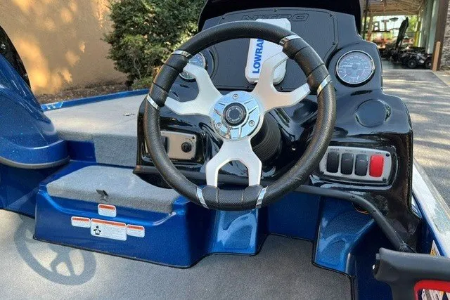 Slide: The Image of Steering wheel of a 2026 Nitro Z17 boat, featuring a modern dashboard design. - 5
