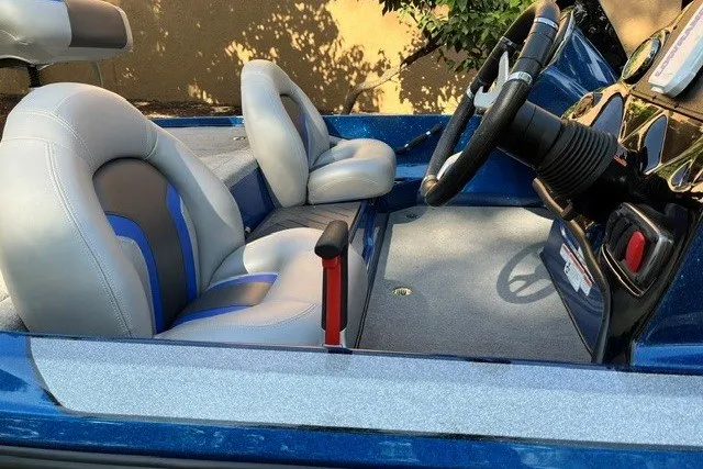 Slide: The Image of 2026 Nitro Z17 boat interior with blue and gray seats, steering wheel, and control panel. - 6